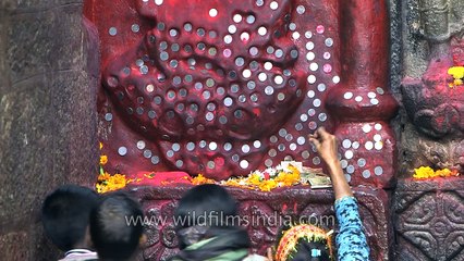 Offering coins to menstruating Indian goddess- Kamakhya Temple
