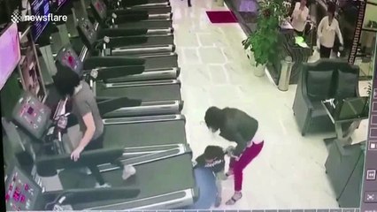 Woman on treadmill has no idea boy behind her has his arm caught underneath it