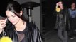 Kendall Jenner flashes her bra during Hollywood night out... as new mum sister Khloe Kardashian's cheating scandal rages on.