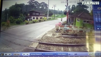 Motorcyclist Clotheslined By Level Crossing