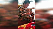 'Kung fu' baby kicks leg when drinking milk