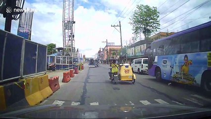 Man lays down in road then gets up again in Philippines