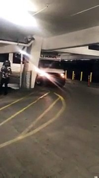 Woman Destroys Her Uhaul Truck After Trying To Fit In A InSide Parking Garage