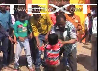 Indian parents dip their kids in cow dung for good luck