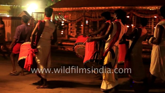 Drunk man stumbles about at cross-dressing Festival in India