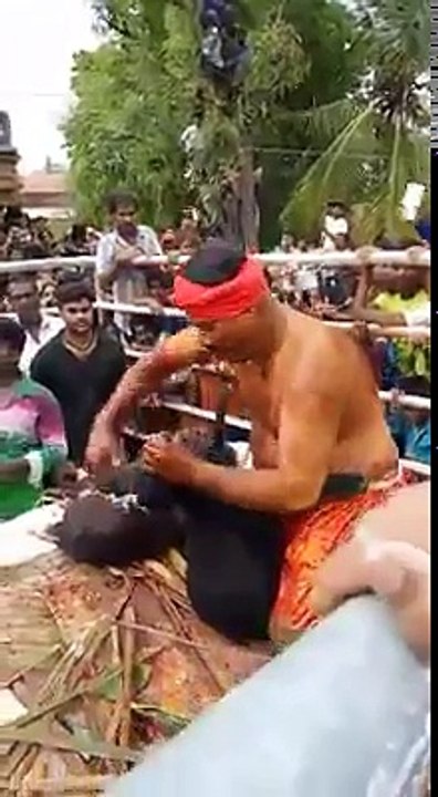 Man Eating Raw Goat and Killing