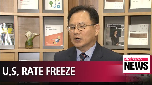 Fed holds rates steady but points to higher inflation