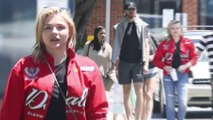 Chloe Moretz cuts a casual figure in a red jacket and ripped jeans for family lunch... after Brooklyn Beckham split.