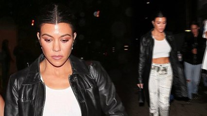 Kourtney Kardashian flaunts her toned tummy for night out with Kendall Jenner in Los Angeles.