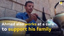 In war-torn Yemen, Ahmed builds vacuums, fridges and fans out of cardboard.