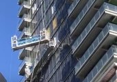 Strong Winds Buffet High-Rise Cleaning Lift in Downtown Toronto