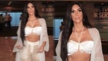 Kim-Kardashian-flaunts-her-abs-in-butterfly-bra-top-with-sheer-slacks-in-Las-Vegas-after-Cher-concert