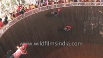 Cars drive sideways- slow motion of crazy Indian fair stunt