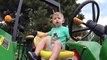 Cute Boy Drives John Deere Tror. Trors for Kids. Video for Children. John Deere Toys
