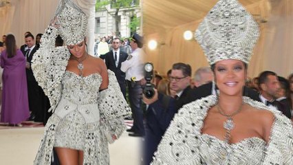 Rihanna channels the Pope as she makes her entrance at the Met Gala in ornate beaded outfit complete with mitre