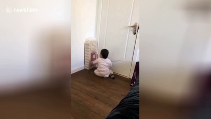 Toddler fights pack of toilet rolls