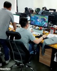This lad has mastered playing games in front of his boss 