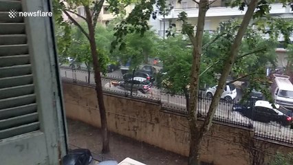 Garbage can strikes cars in sudden Greece rainstorm