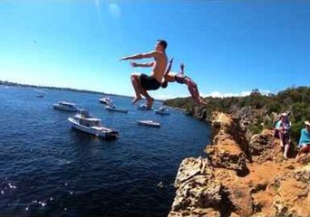 Outdoor Enthusiasts Jump Cliffs in Western Australia