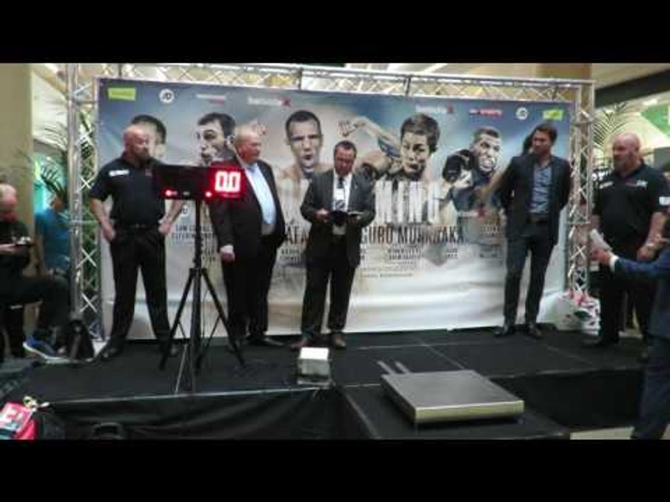 Shove! Adam Harper pushes Ryan Kelly at the weigh in