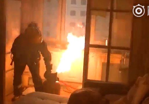 Chinese Firefighters Carry Burning Gas Tank Down Nine Floors Before Extinguishing It Outside