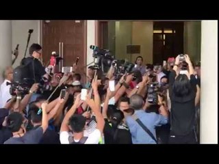Najib all smiles as he leaves court for home