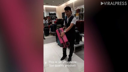 Student wows shoppers with his VERY enthusiastic suitcase sales pitch