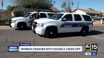 Woman crashes into Phoenix garage and flees