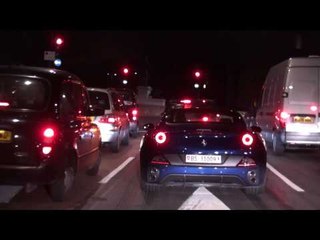 Blue Ferrari California Accelerating on Park Lane in London