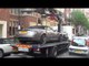 Aston Martin DB9 Volante being lifted and towed away in Knightsbridge, London