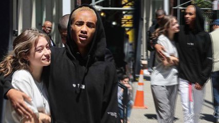 Jaden Smith cuddles up to beaming girlfriend Odessa Adlon as they step out after Met Gala