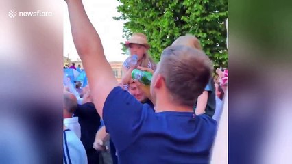 Pep Guardiola chucks beer to fan during Manchester City parade