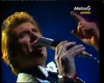 Johnny Hallyday et Sylvie Vartan - 'Que Je T'Aime' sur Système 2 (23/11/75) : Une Performance Inoubliable des Légendes du Rock et de la Chanson Française !