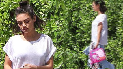 Mila Kunis carries daughter Wyatt's Peppa Pig lunch bag to the car as busy mom runs errands