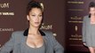 Bella Hadid looks busty in fitted mini dress and matching blazer at Cannes Film Festival.