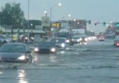 Cars Drive Through Flooded Road as Storm Hits Oklahoma