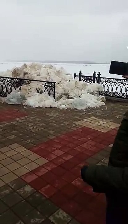 Moving Ice Breaks Metal Fence