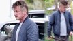 Sean Penn goes casual in flip flops to walk his dog... after partying with Chris Martin and Bono