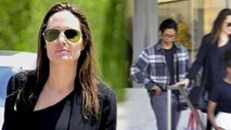 Angelina Jolie, 42, is slender is black as she takes only TWO of her six kids shopping on Mother's Day