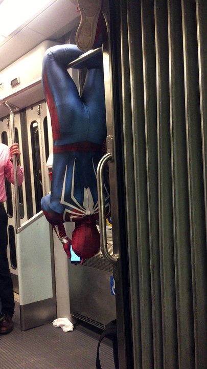 Spiderman Texting on a Train