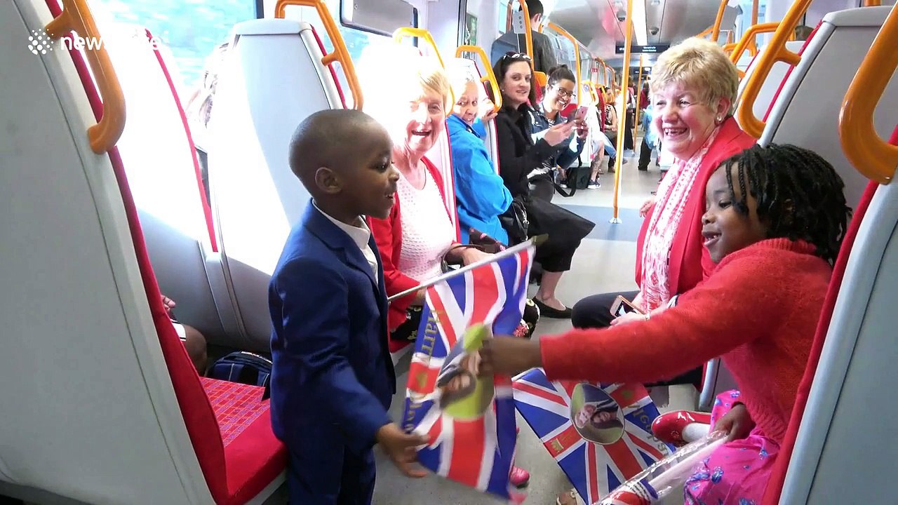 Train passengers have fun on early train en route to royal wedding