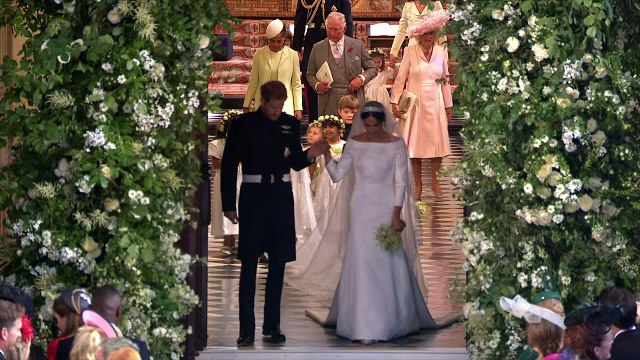 Newlyweds Prince Harry and Meghan Markle leave chapel