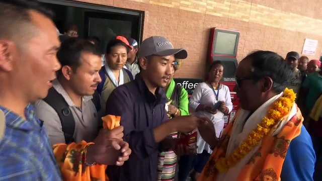 Record-breaking climbers return from Mount Everest