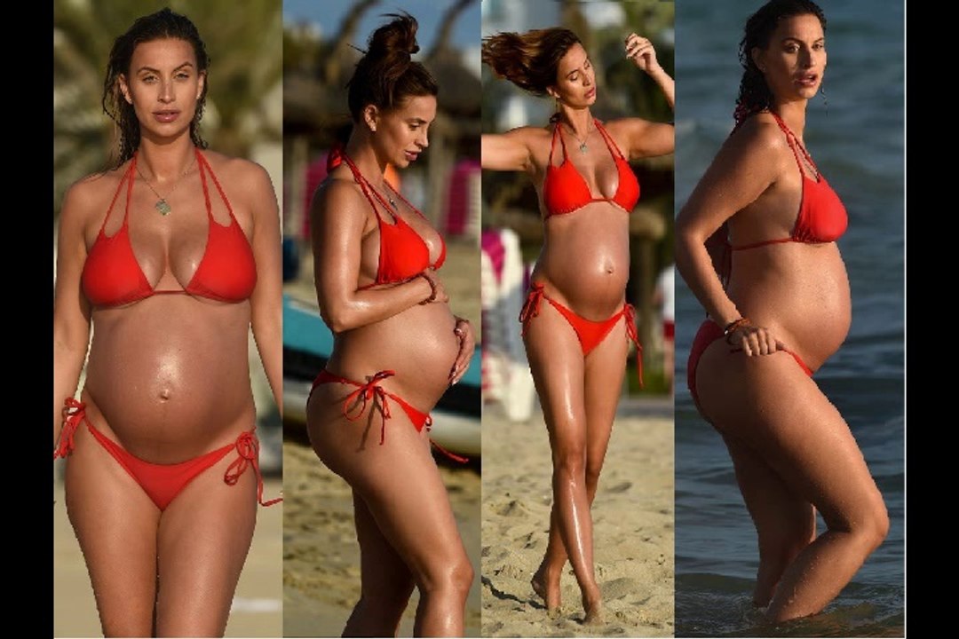 Heavily pregnant Ferne McCann cradles her blossoming baby bump in a red string bikini as she hits the beach in Majorca