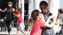 Halle Berry shows off sculpted arms as she tries to keep phone away from daughter Nahla in Beverly Hills