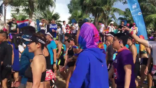 Thai runners display skin at Pattaya bikini beach race