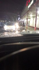 Disturbing Event Unfolds as Car Reverses into Glass Door