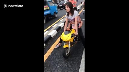 Woman arrested after riding motorbike with three-year-old nephew on the back