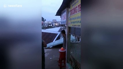 Terrifying moment houses swept away into river by landslides