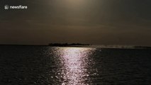 Water bombers skim lake to refill during Canada forest fires